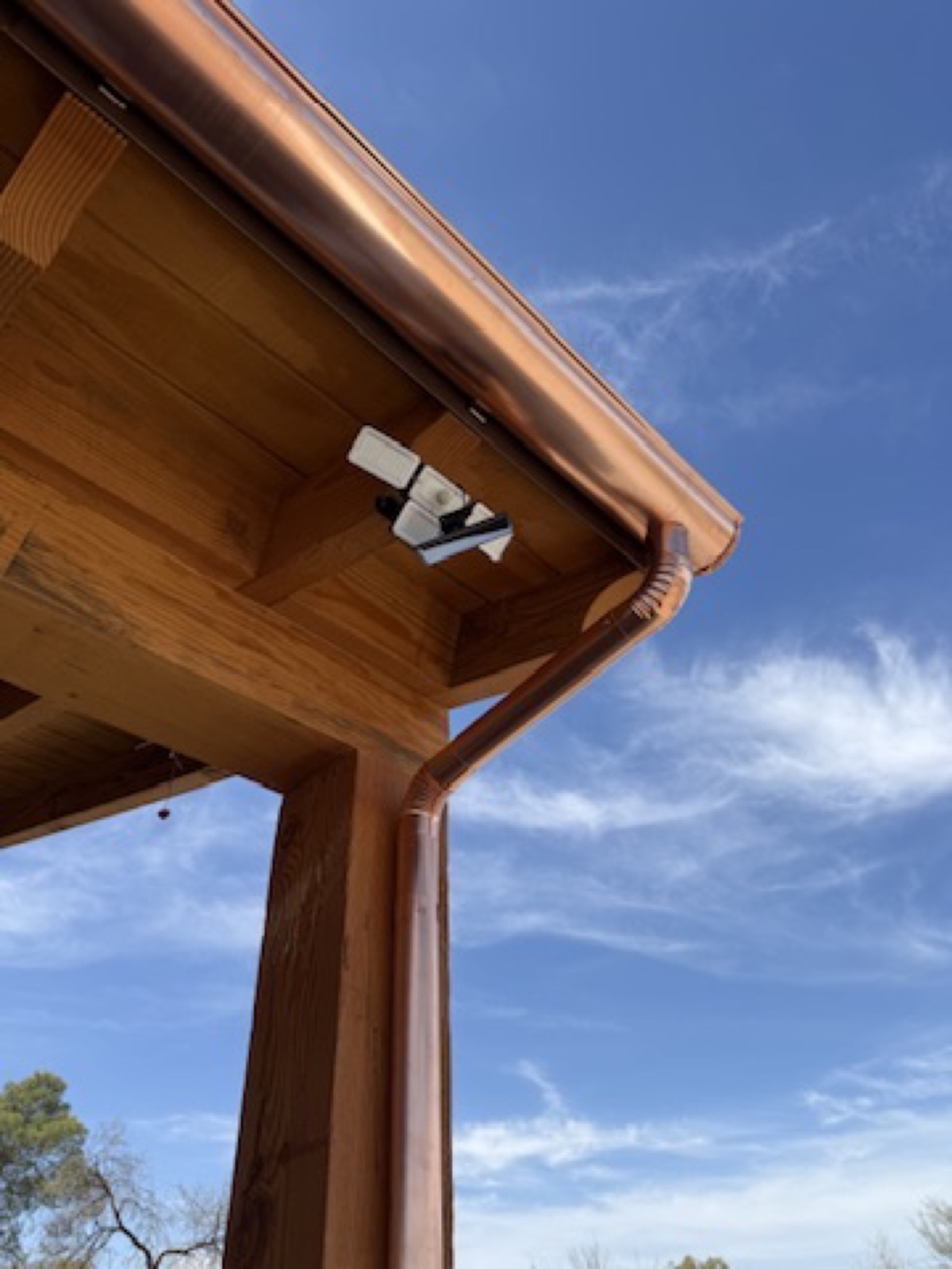City Seamless rain gutter downspout installation detail.