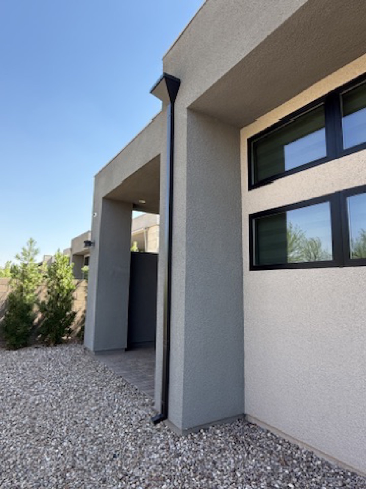 City Seamless rain gutter downspout installation detail.