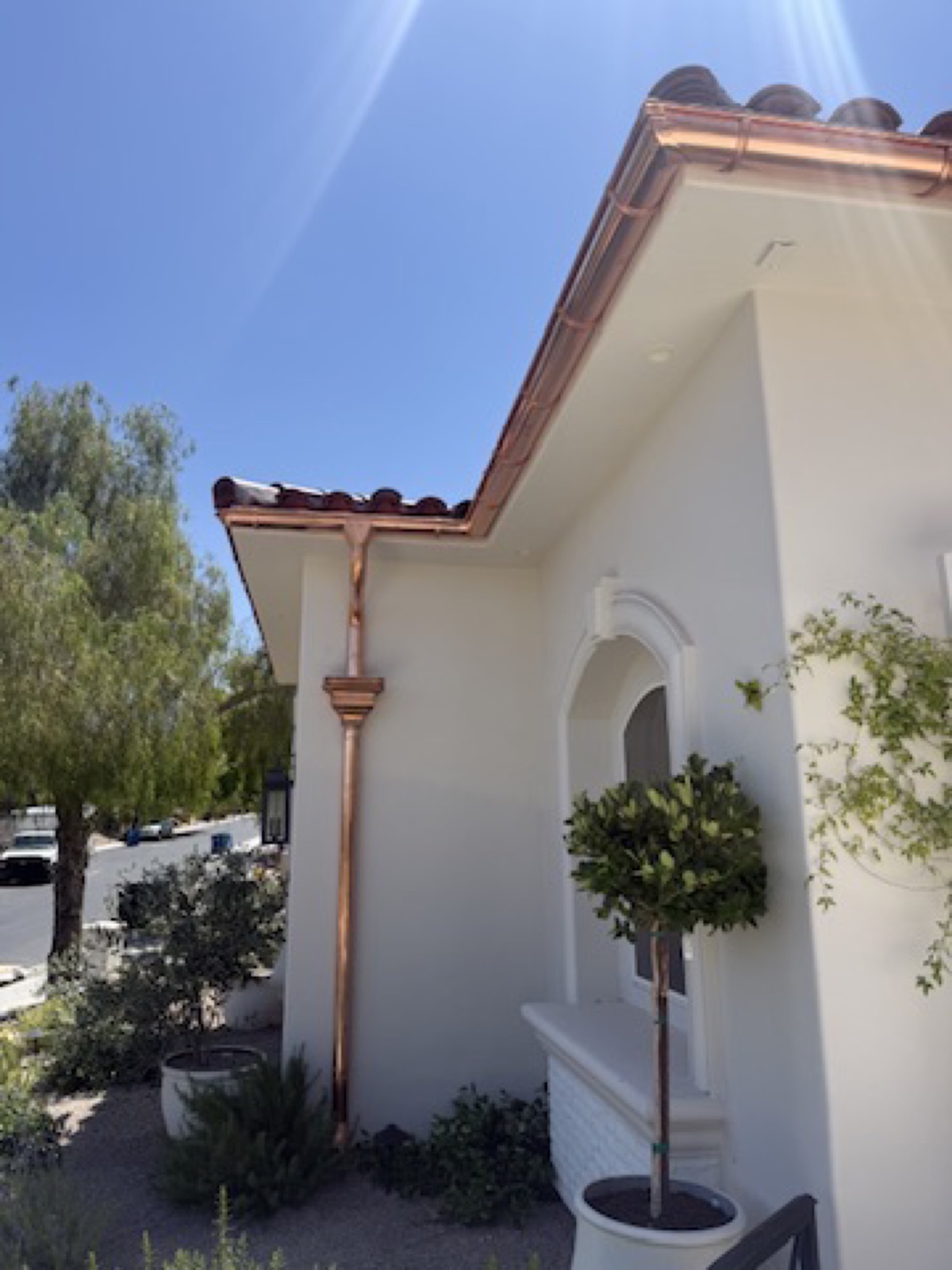 City Seamless half-round rain gutter installation on a custom Southern Nevada home.