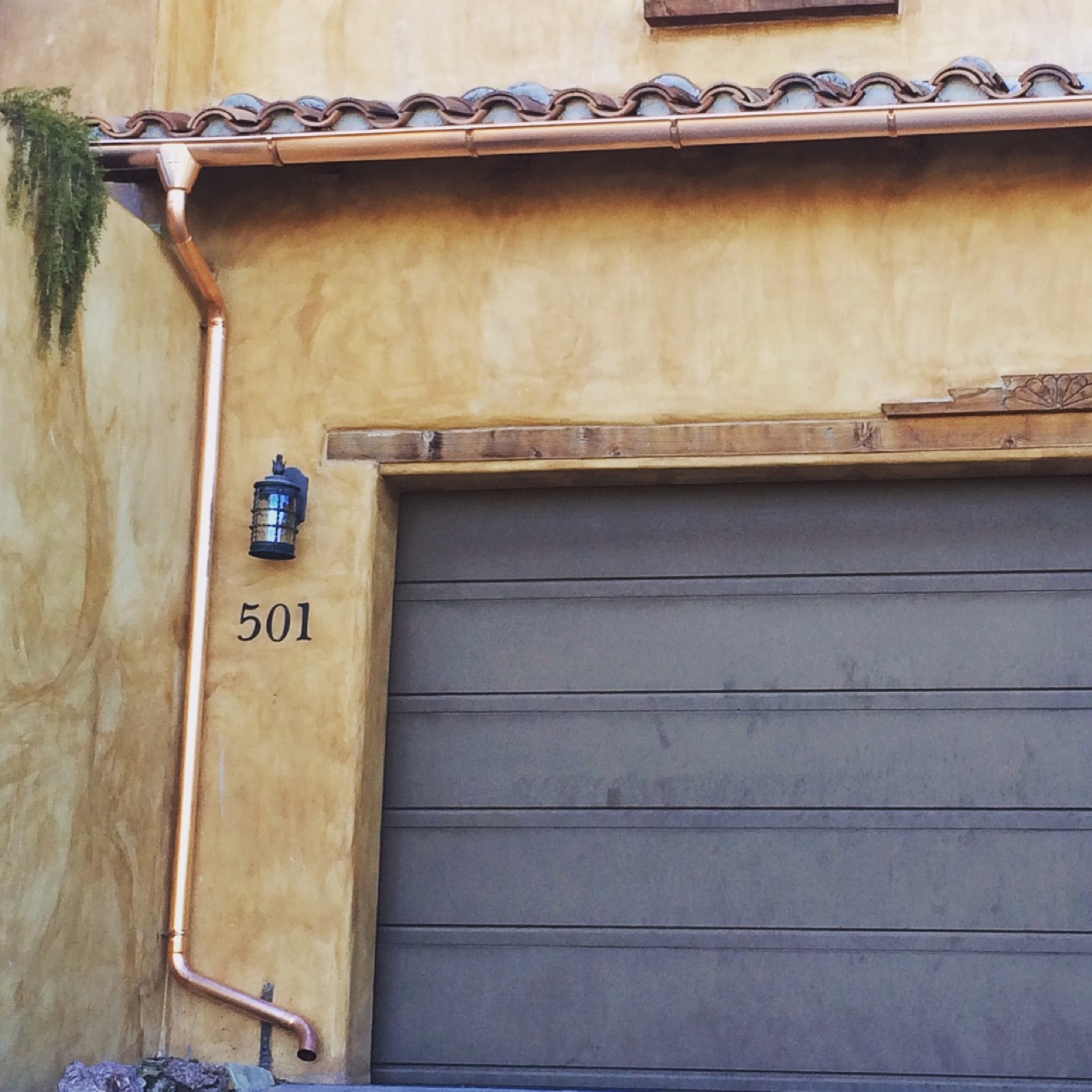City Seamless half-round rain gutter with downspout routing on a custom home.