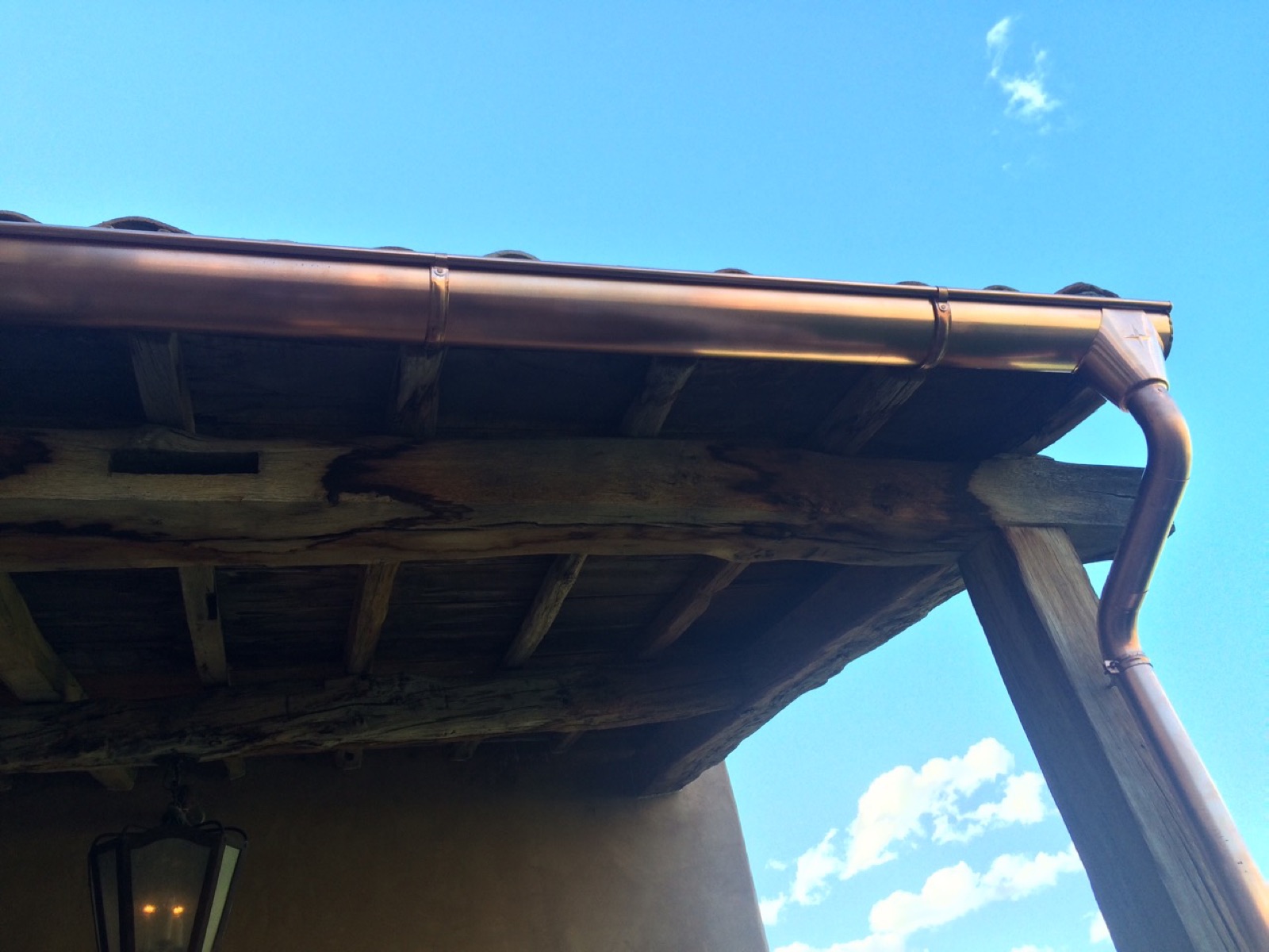 City Seamless half-round rain gutter installation on a custom home.