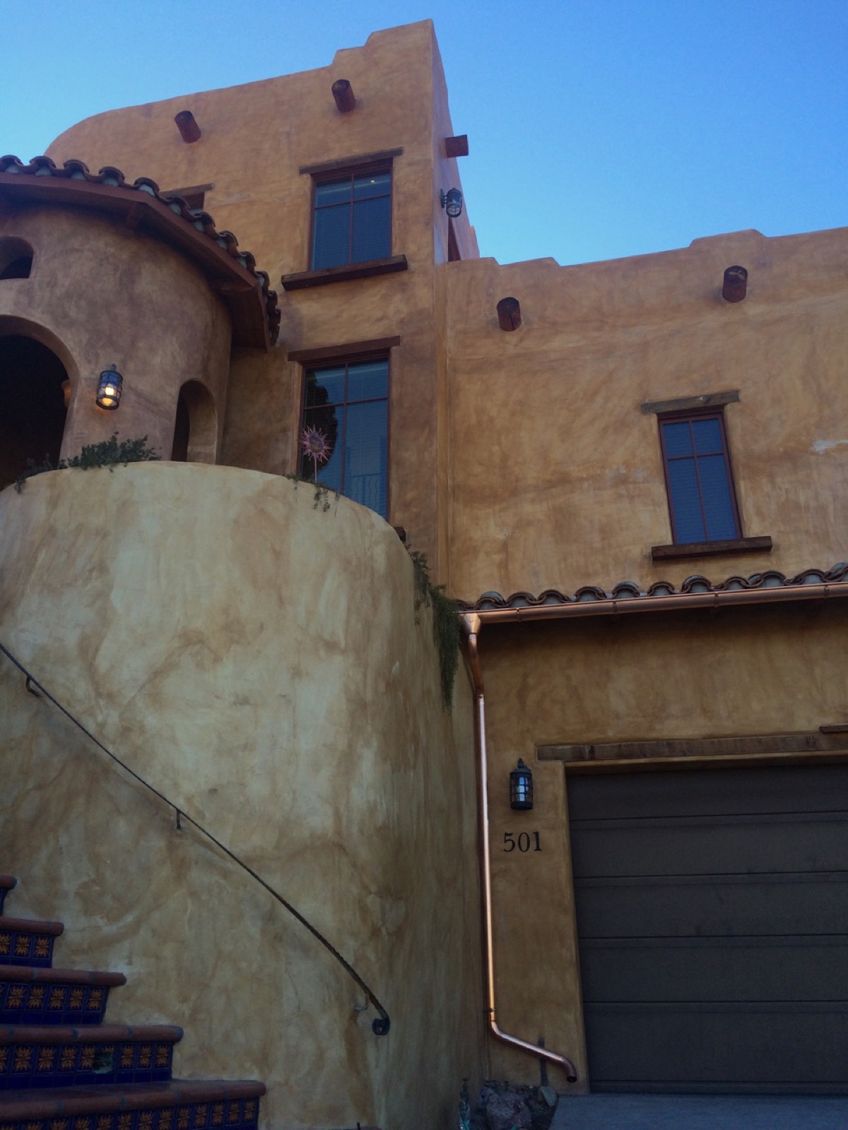 City Seamless half-round rain gutter with downspout routing on a custom home.