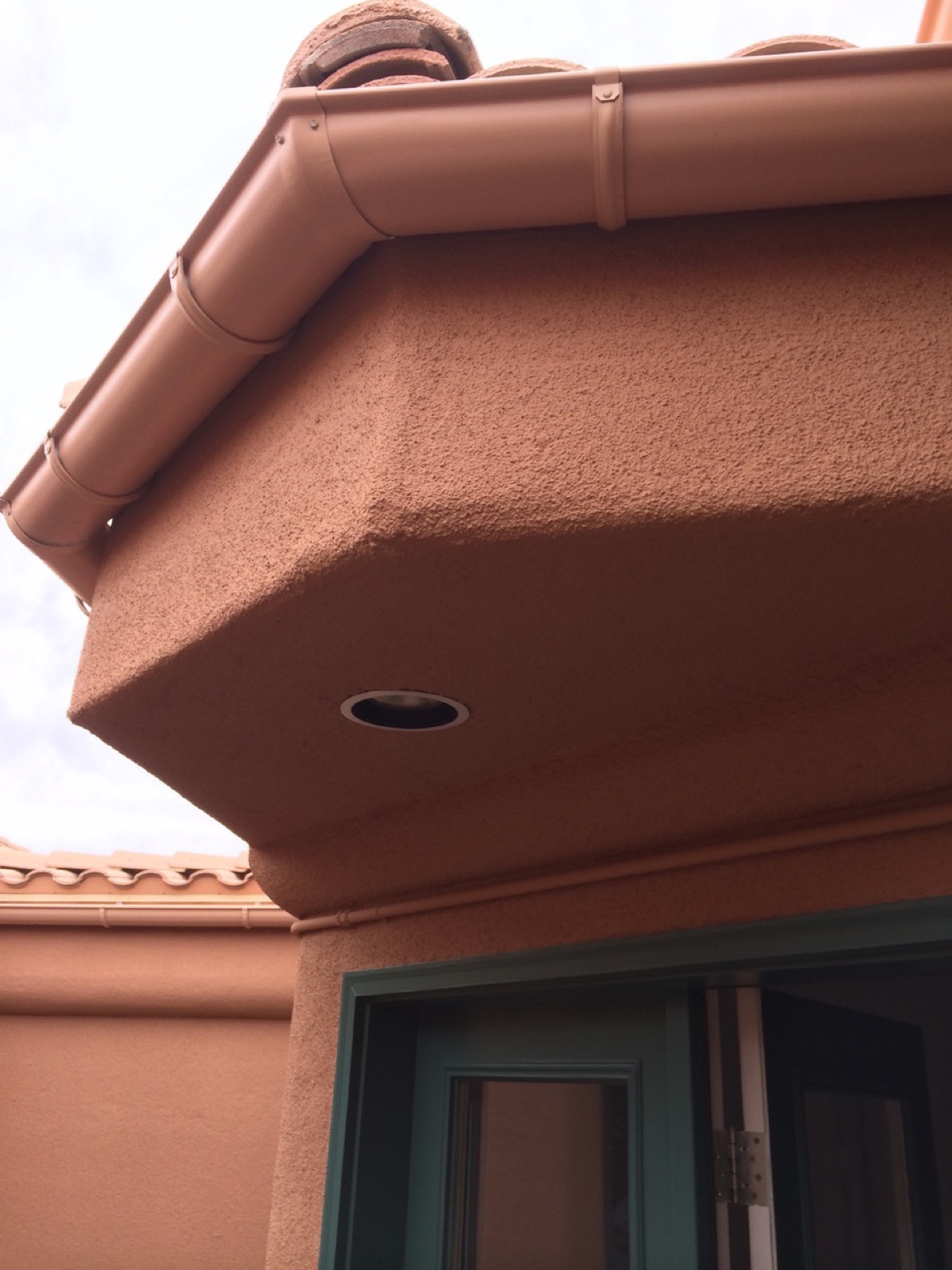 City Seamless half-round rain gutter installation on a custom home.