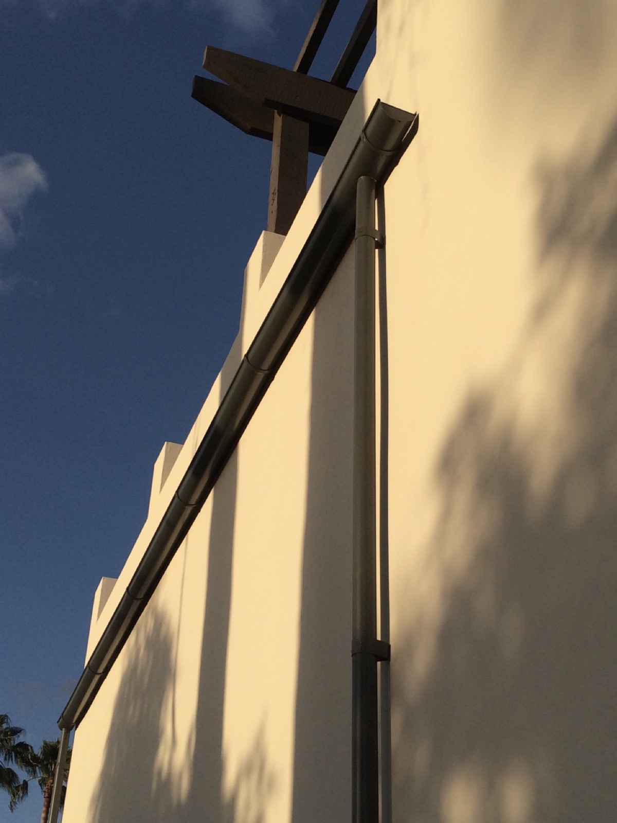 City Seamless half-round rain gutter installation on a custom home.