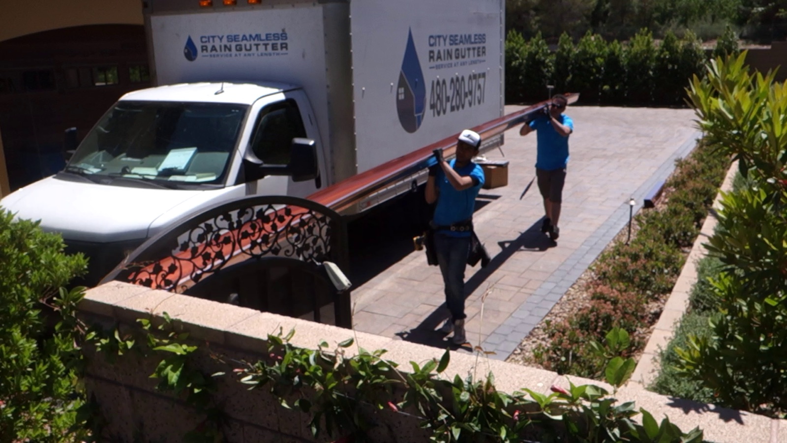City Seamless rain gutter installation crew and equipment photo.