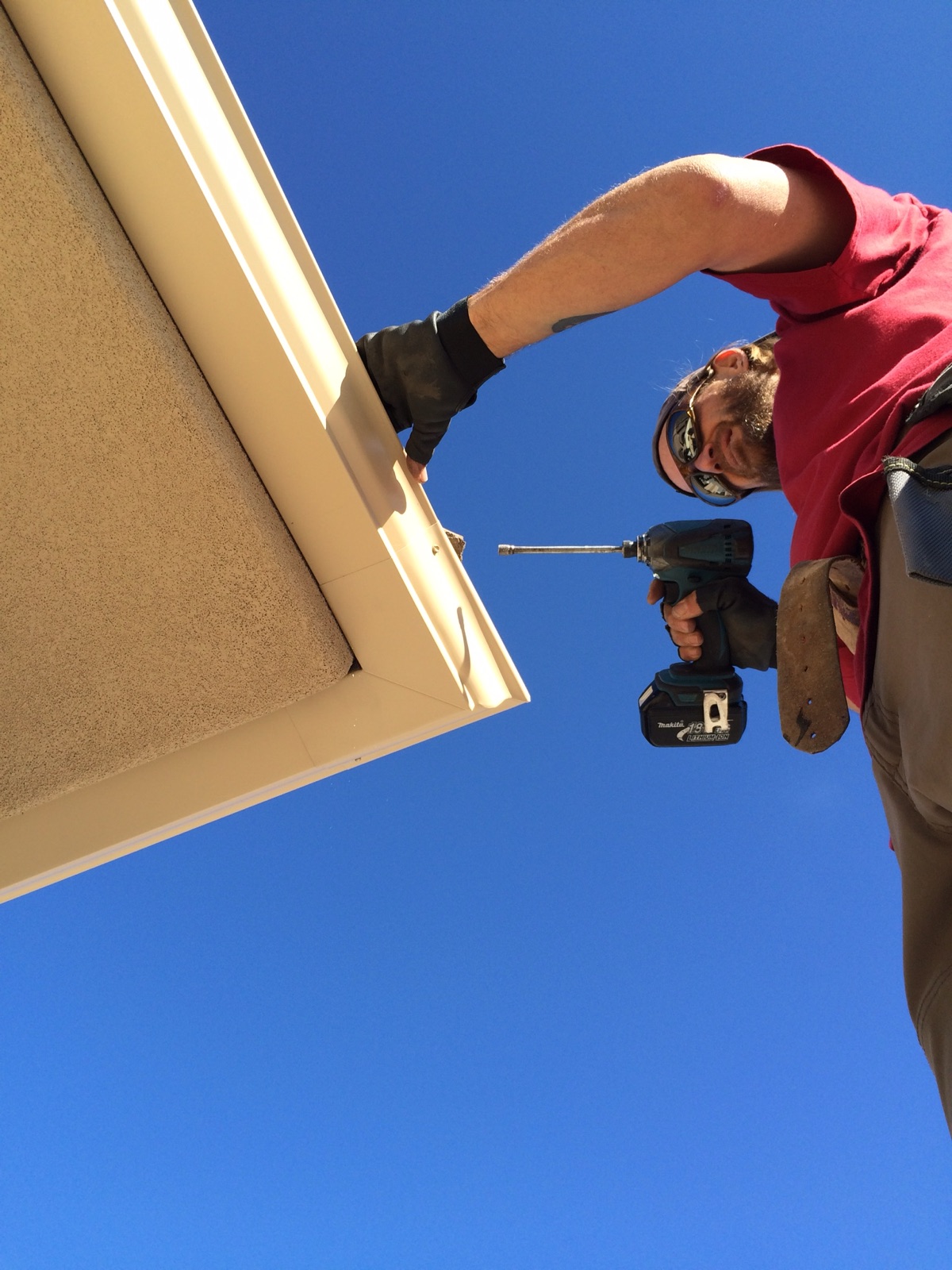 City Seamless rain gutter installation crew and equipment photo.