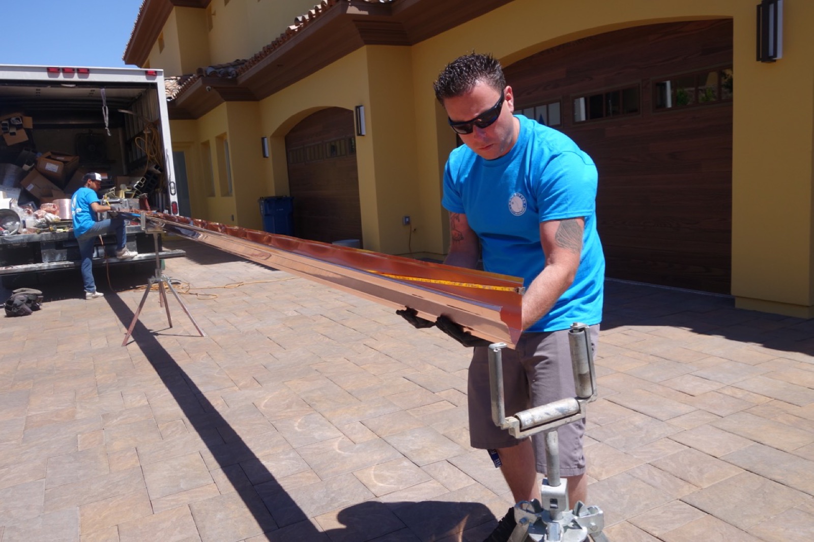 City Seamless rain gutter installation crew and equipment photo.