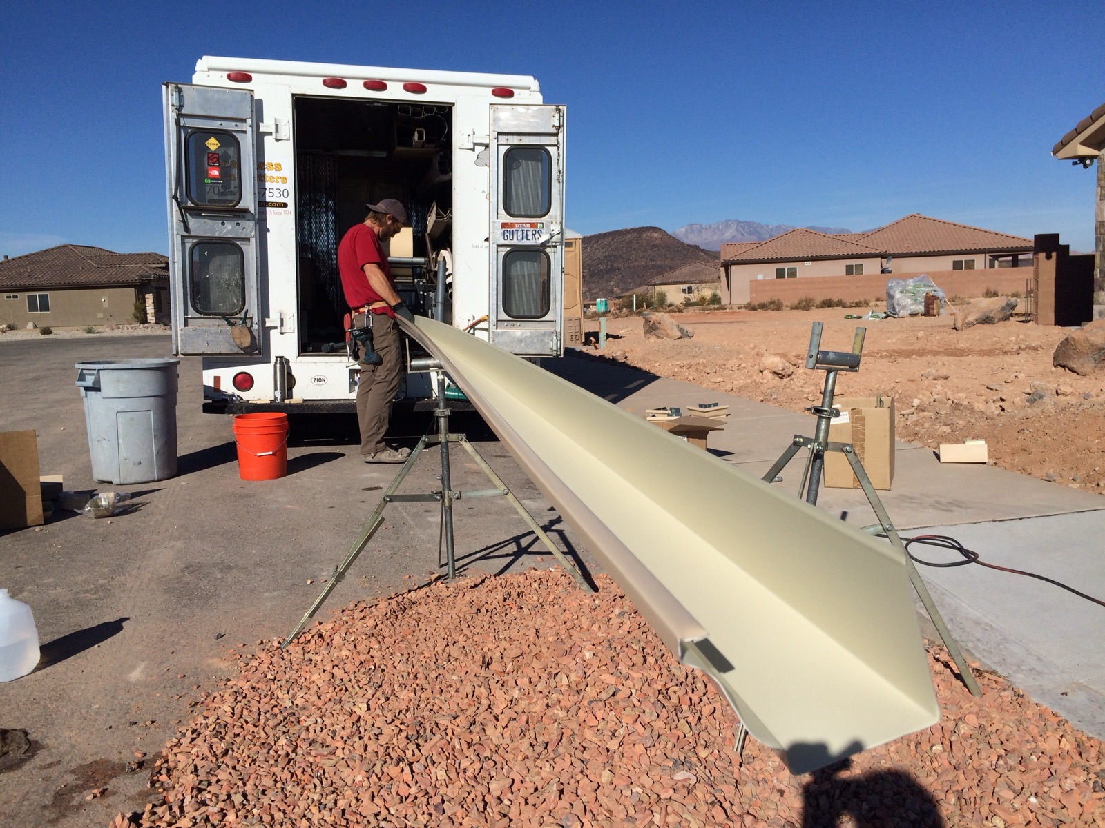 City Seamless rain gutter installation crew and equipment photo.