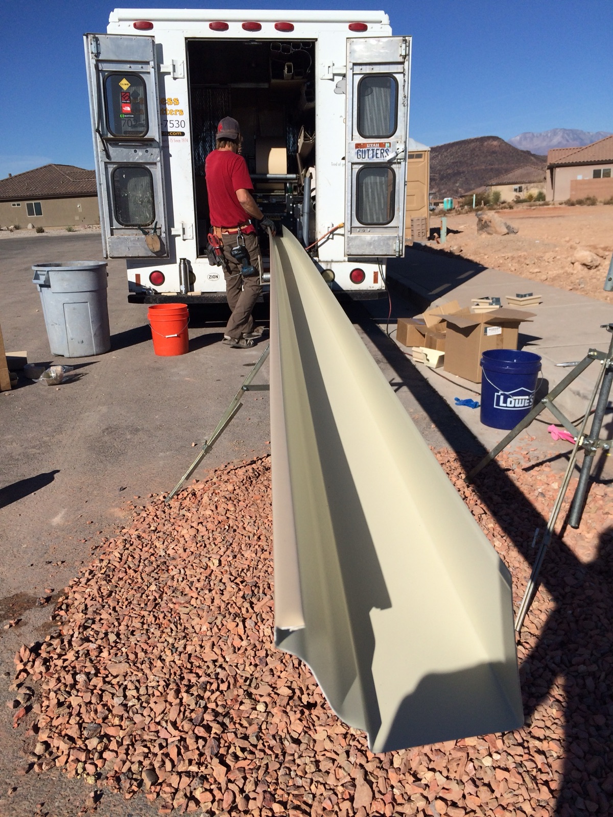 City Seamless rain gutter installation crew and equipment photo.