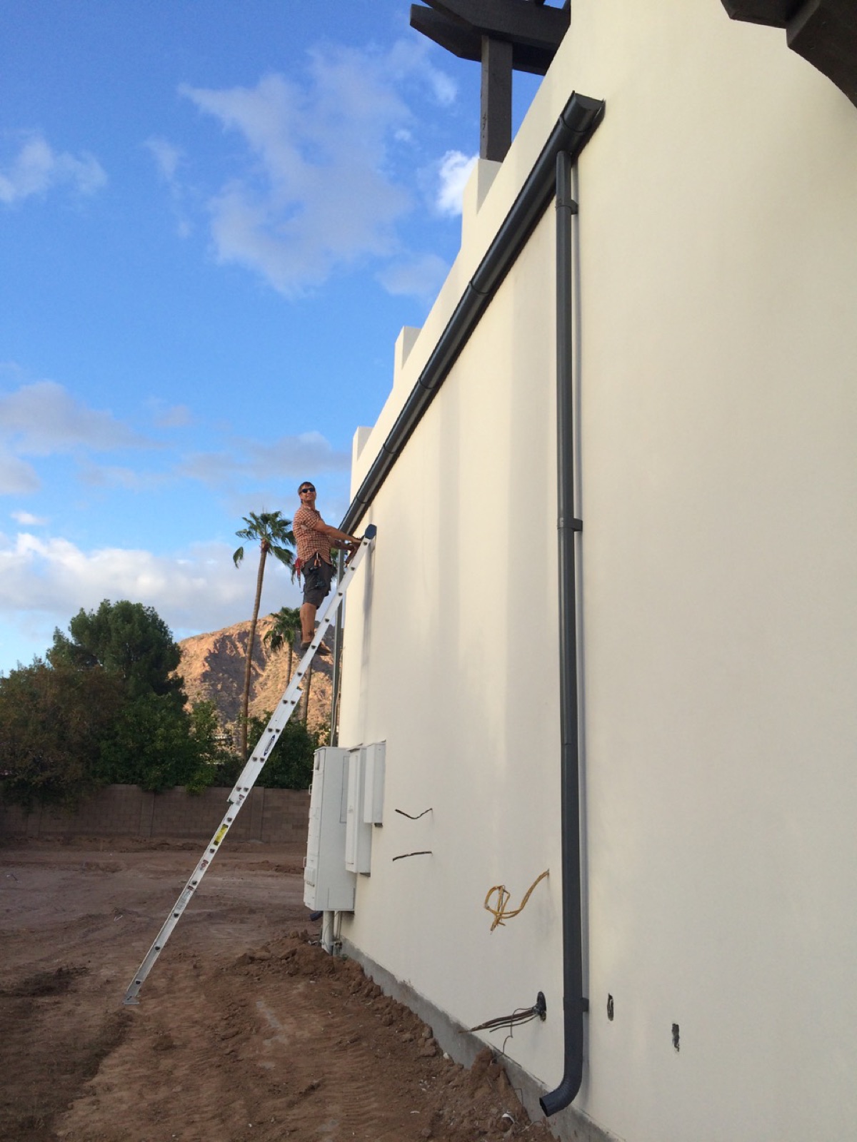 City Seamless rain gutter installation crew and equipment photo.