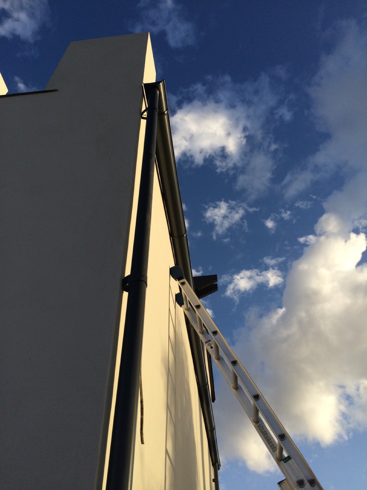City Seamless rain gutter installation crew and equipment photo.