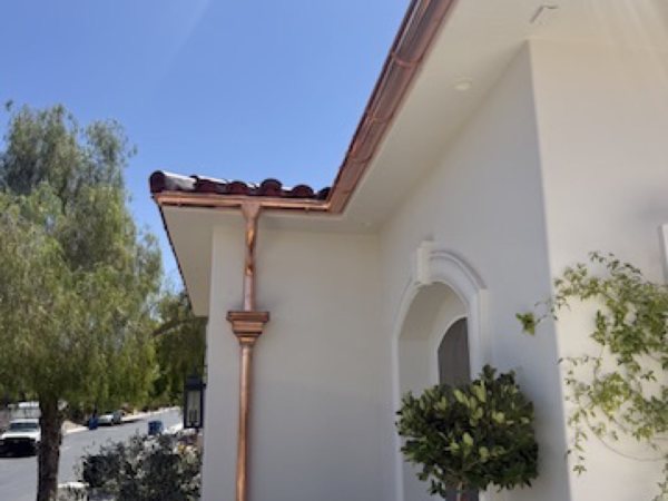 City Seamless half-round gutter with collection box and downspout drainage detail.