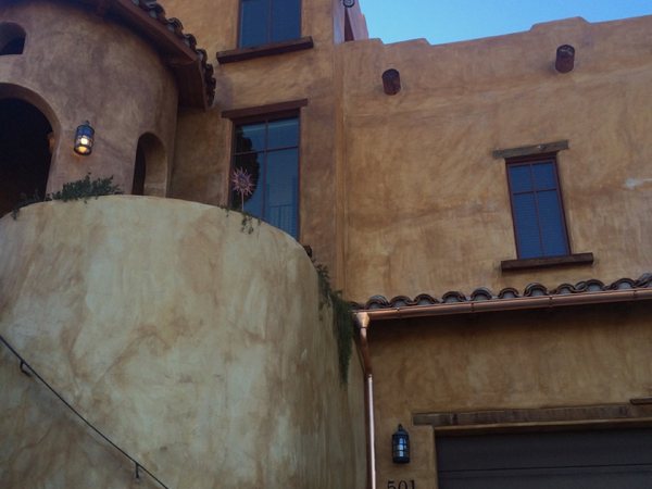 City Seamless half-round rain gutter with downspout routing on a custom home.