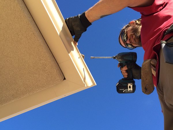 City Seamless rain gutter installation crew and equipment photo.