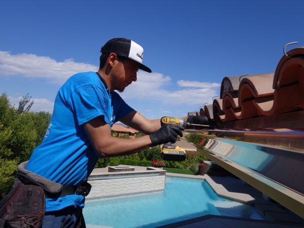City Seamless rain gutter installation crew and equipment photo.