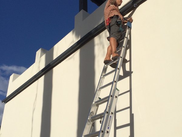 City Seamless rain gutter installation crew and equipment photo.