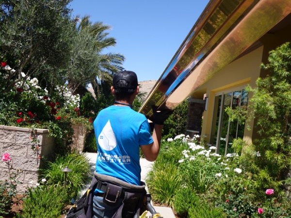 City Seamless rain gutter installation crew and equipment photo.