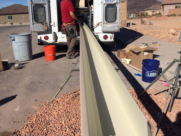City Seamless rain gutter installation crew and equipment photo.