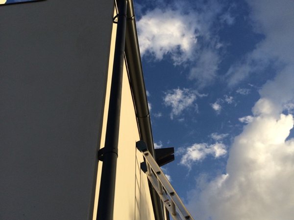 City Seamless rain gutter installation crew and equipment photo.