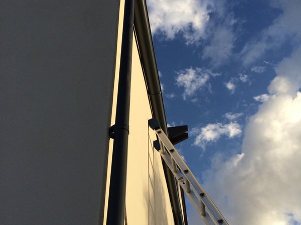 City Seamless rain gutter installation crew and equipment photo.
