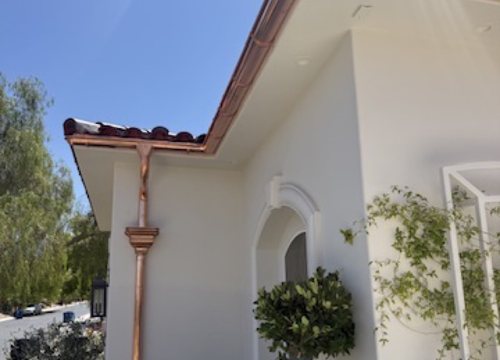City Seamless half-round gutter with collection box and downspout drainage detail.