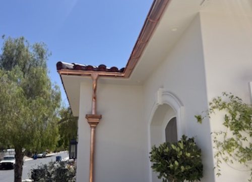City Seamless half-round gutter with collection box and downspout drainage detail.